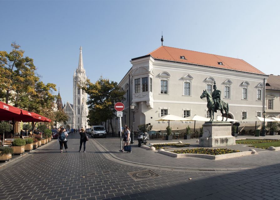 Budapest: Buda Walking Tour - Cobblestone climbs, red-tiled houses, and hidden alleyways