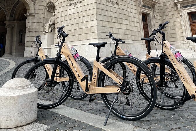 Budapest: Historic Downtown ride on E-Bicycles Buda & Pest - The Danube walk-on moment: Shoes on the Danube Bank