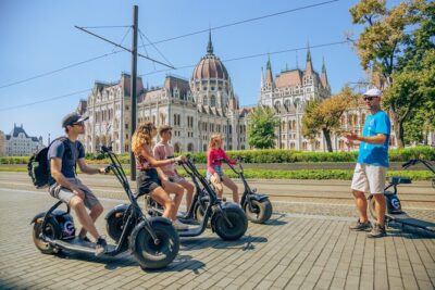Budapest Small-Group Guided Tour on MonsteRoller e-Scooter - Pest Highlights on Scooter: Parliament Viewpoint, St Stephen’s, Liberty Square, and the Opera Lobby